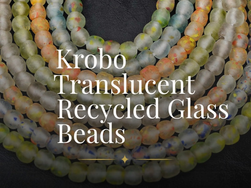 Collection banner for Aadampo Krobo Recycled Glass Beads featuring multiple strands of translucent handcrafted Ghanaian glass beads in soft green, blue, ivory, and amber 
