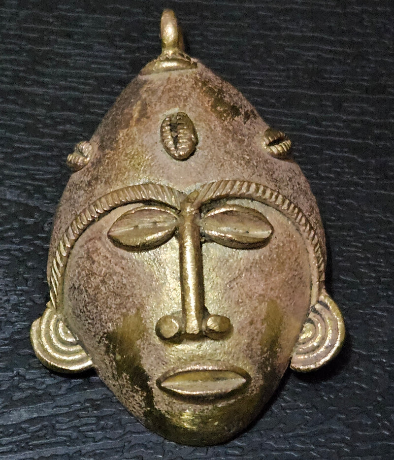 Crafted with Care: Authentic African Brass Mask Pendant