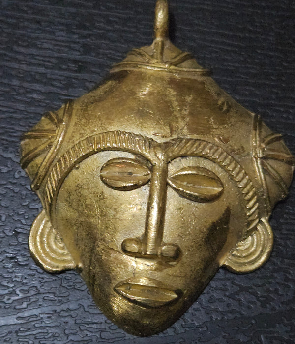 Unique Artistry: African Brass Tribal Mask Pendant - Limited Stock.