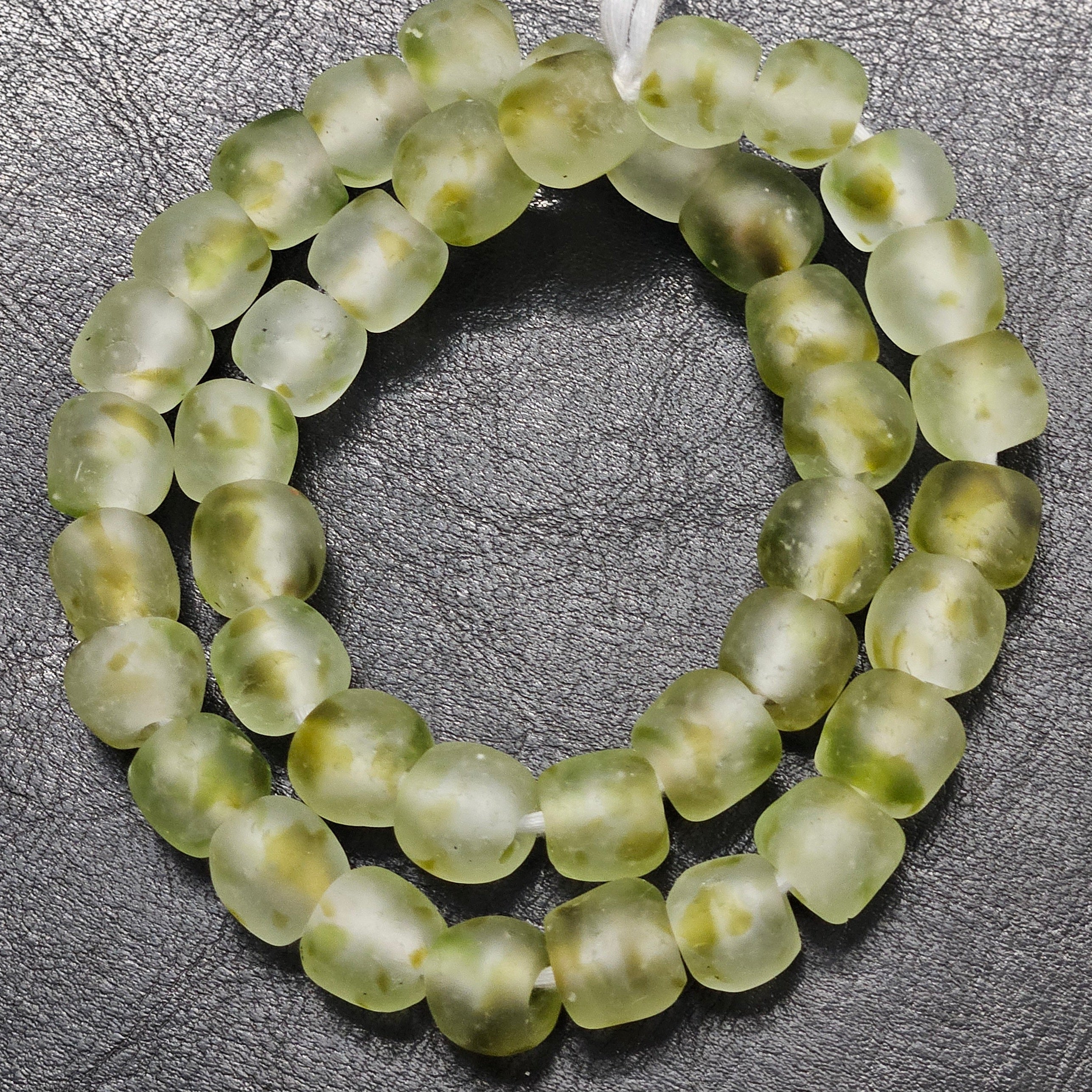Looking for something both authentic and sustainable? These recycled glass beads from Ghana are running low – act fast to secure your strand today!