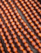 Handmade Krobo Pocket Glass Beads from Ghana – Amber Brown 13–14mm Strand