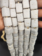 Authentic Classic Ivory Cube Tube Krobo Powdered Glass Beads handcrafted from recycled glass by Krobo artisans in Ghana.