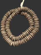 Handcrafted Sahara Clay Ashanti glass rondelle beads from Ghana made from recycled glass featuring large holes and a matte earth-tone artisan finish.
