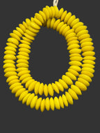 Handcrafted Sankofa Gold Ashanti glass rondelle beads from Ghana made from recycled glass featuring large holes and a vibrant matte artisan finish.