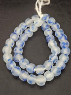 Authentic African cobalt blue translucent Krobo recycled glass beads handcrafted in Ghana featuring frosted round handmade beads created from recycled glass for luxury jewelry making.