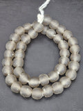 Authentic smoke gray translucent Krobo recycled glass beads handcrafted in Ghana featuring frosted handmade round beads for luxury jewelry making, sustainable designer collections, and contemporary artisan creations