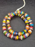 Authentic handmade designer mix Krobo translucent recycled glass rondelle beads from Ghana featuring vibrant multicolor frosted finishes for jewelry making and wholesale sourcing.