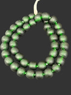 Handcrafted Emerald Frost Krobo Pocket Glass Beads from Ghana featuring frosted translucent green recycled glass with artisan craftsmanship.