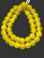 Handcrafted Golden Sunrise Krobo Pocket Glass Beads from Ghana featuring frosted translucent yellow recycled glass with artisan craftsmanship.