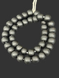 Handcrafted Midnight Eclipse Krobo Pocket Glass Beads from Ghana featuring matte black recycled glass with authentic artisan craftsmanship.