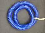 Authentic handmade royal blue Krobo translucent recycled glass rondelle beads from Ghana featuring a matte frosted finish for jewelry making, designer collections, and wholesale sourcing.