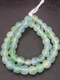Authentic seafoam blue and mint Krobo translucent recycled glass beads handcrafted in Ghana featuring frosted handmade round beads for luxury jewelry making, sustainable designer collections, and artisan creations.