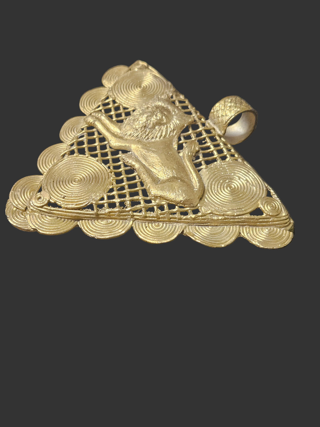 Adinkrahene oncentric circular and spiral brass decoration surrounding the lion on a Ghanaian pendant.