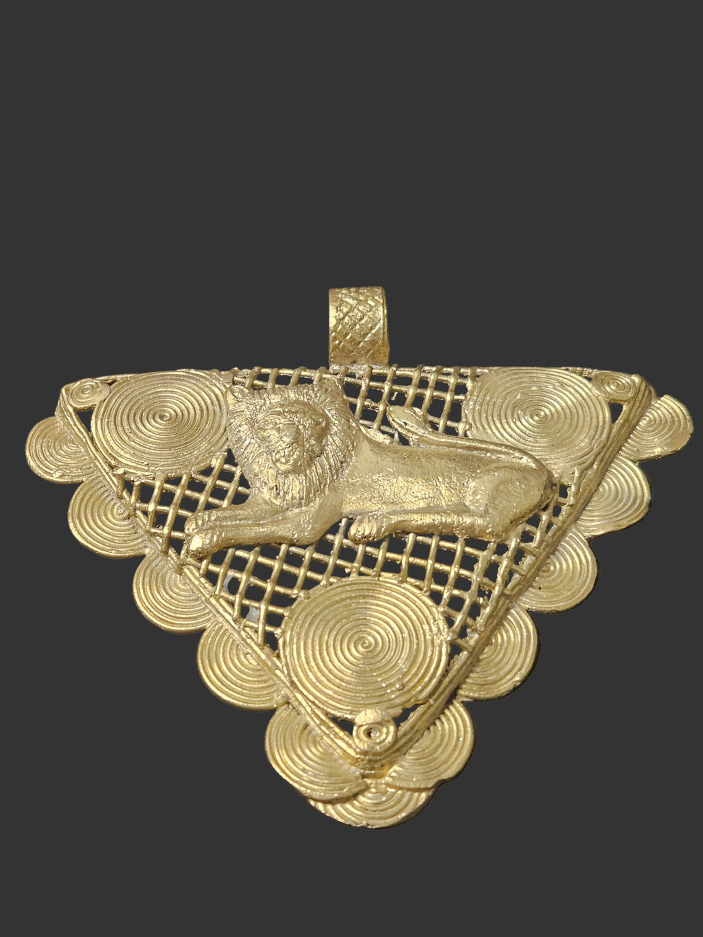 Oversized African brass lion pendant from Ghana with Adinkrahene-inspired concentric circular motifs.