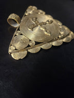 Large textured bail at the top of a handcrafted Ghanaian Akofena brass pendant.