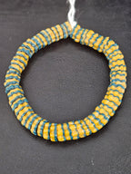 Handcrafted golden yellow and teal blue Krobo glass spacer beads from Ghana featuring recycled glass artisan craftsmanship and striped spacer-bead design.