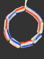 Handcrafted heritage celebration painted Krobo glass beads from Ghana featuring red white and blue artisan designs on recycled glass tube beads.