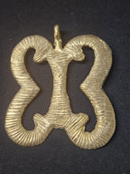 Oversized handcrafted Pempamsie Adinkra symbol pendant made from traditional Ashanti brass in Ghana representing preparedness, resilience, discipline, strategic planning, and enduring success.