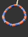 Handcrafted red white and blue painted Krobo glass tube beads from Ghana made from recycled glass for jewelry making and heritage-inspired designs.