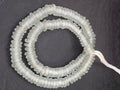 Authentic handmade frost white Krobo translucent recycled glass rondelle beads from Ghana featuring a matte frosted finish for jewelry making, designer collections, and wholesale sourcing.