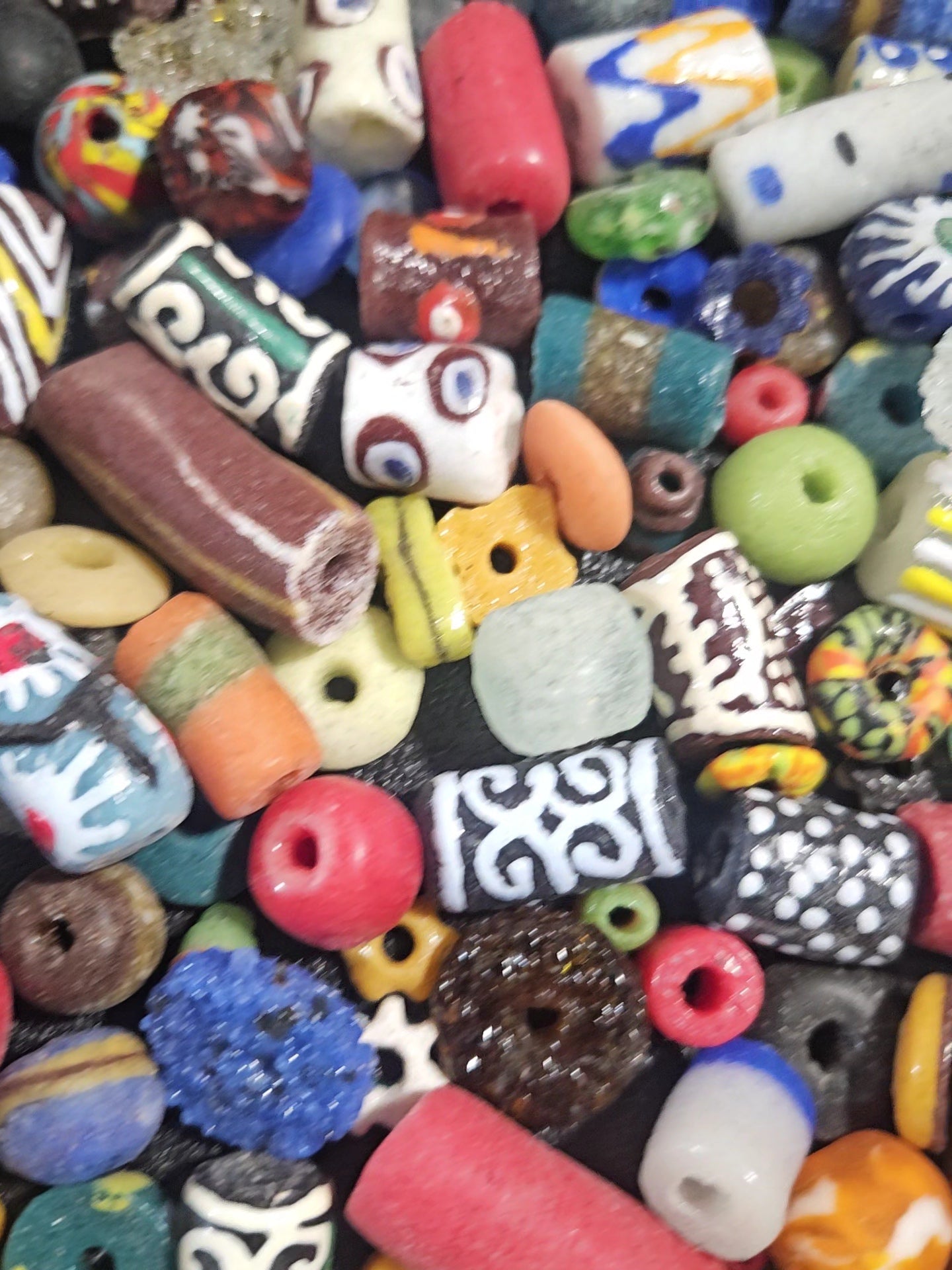 Patterned bead textures with multicolor speckles.