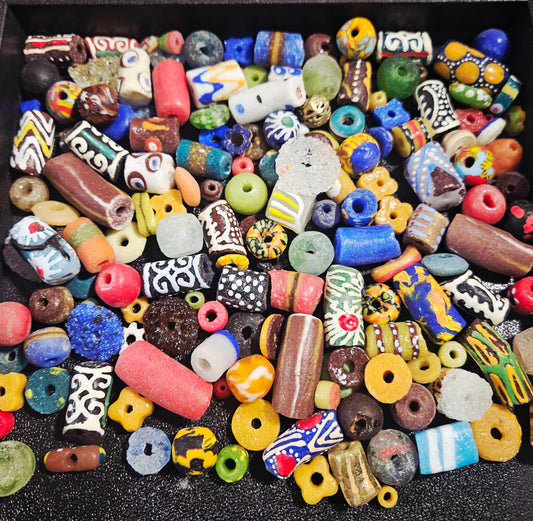 Close-up of speckled artisan beads showing hand-painted details.