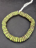 Handcrafted spring green and cocoa brown Krobo glass spacer beads from Ghana featuring recycled glass artisan craftsmanship and striped spacer-bead design.