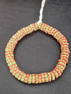Handcrafted green and coral red striped Krobo glass spacer beads from Ghana featuring recycled glass artisan craftsmanship and ridged spacer-bead design.