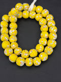 Handcrafted Sunburst Yellow Fused Krobo Recycled Glass Beads from Ghana, approximately 12–14mm artisan beads on strand for jewelry making and designer collections.