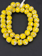 Handcrafted Sunburst Yellow Fused Krobo Recycled Glass Beads from Ghana, approximately 12–14mm artisan beads on strand for jewelry making and designer collections.