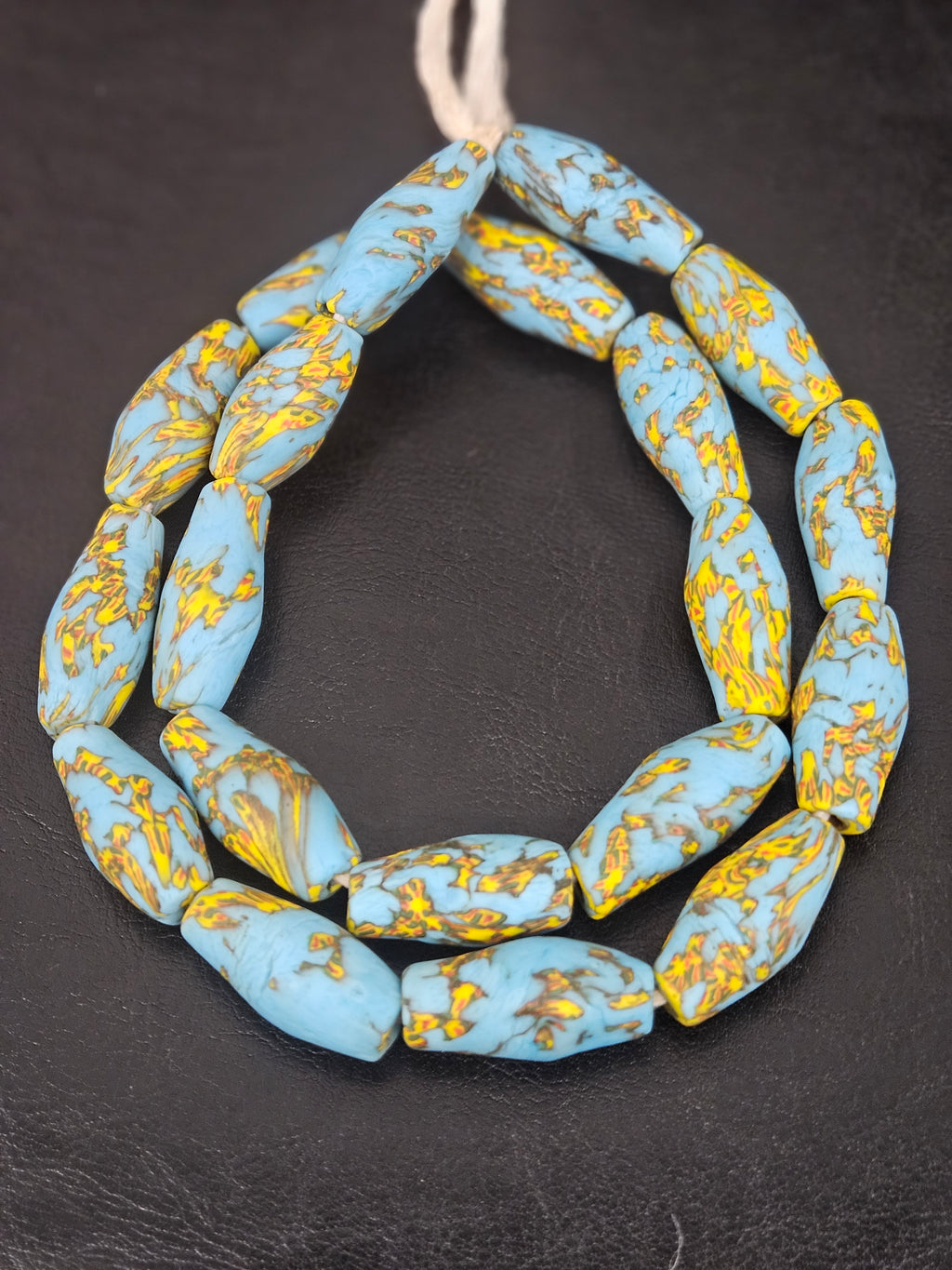 Handcrafted XL sky blue and golden fused Krobo recycled glass beads from Ghana, approximately 12–14mm x 30–34mm artisan statement beads for jewelry making.