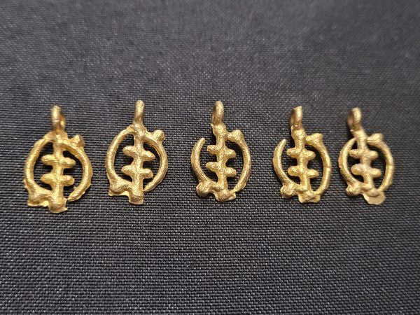 5 Adinkra brass pendants.